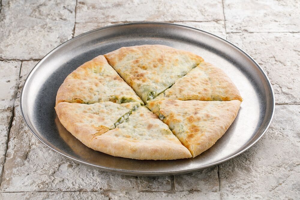 Khachapuri with cheese and greens