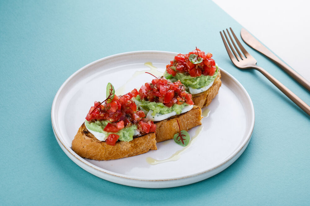 Bruschetta with tomatoes and guacamole