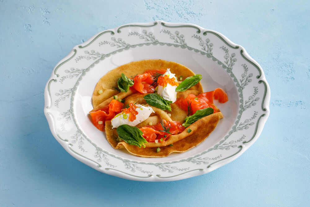 Pancakes with salmon, cheese and red caviar