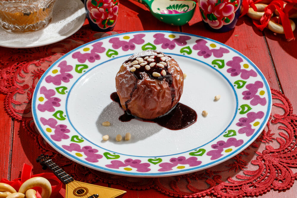 Baked apple with jam and nuts