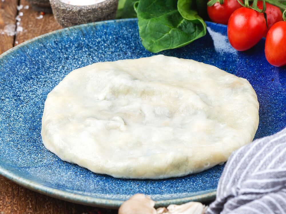 Kvari with chees, herbs and mushrooms