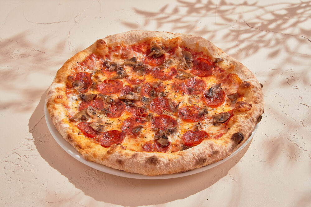 Toscana pizza with mushrooms and salami
