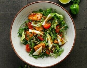 Salad with warm trout, imeretian cheese and pumpkin seeds