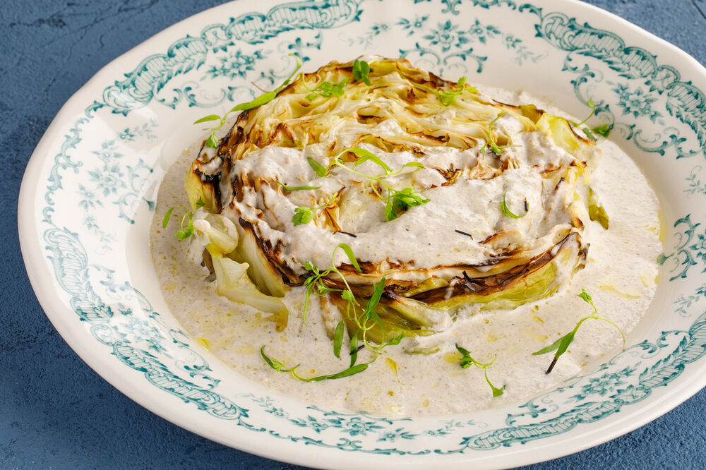 Young cabbage steak with truffle sauce