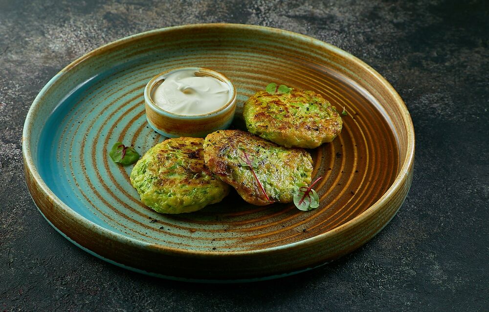 Zucchini pancakes with sour cream