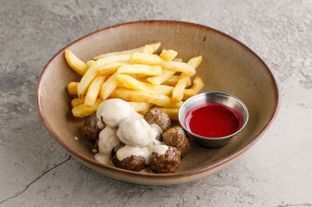 Swedish pork and beef meatballs with lingonberry sauce and fries