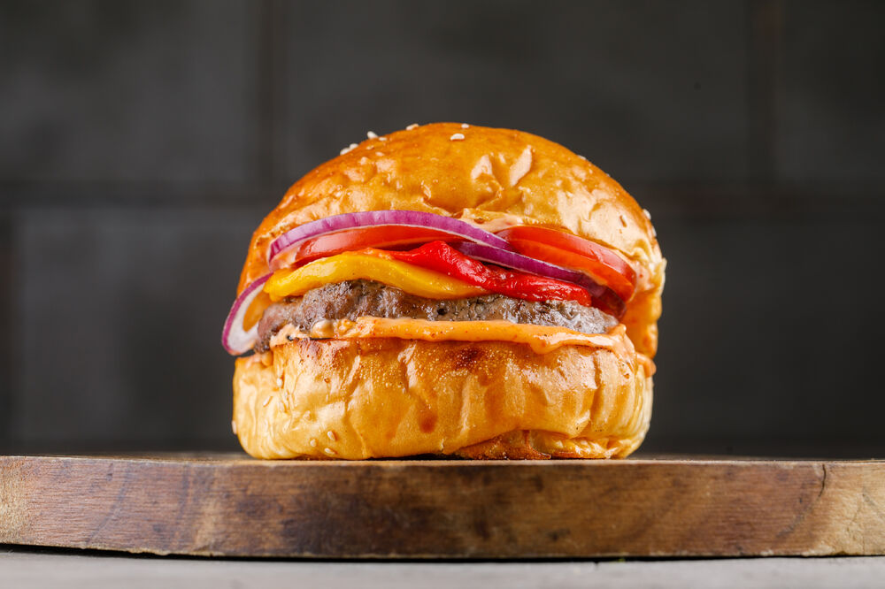 Burger with roasted peppers and spicy sauce