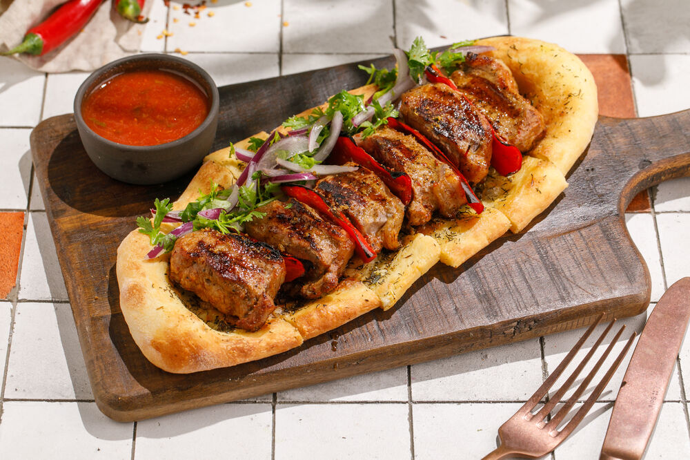 Grilled saddle of lamb on spicy flatbread