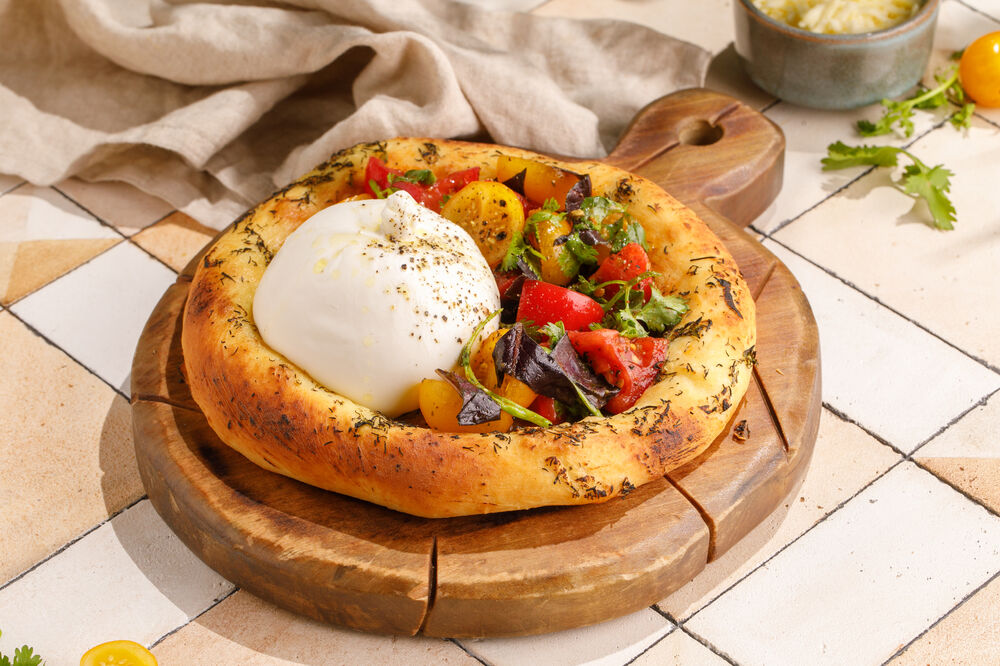 Spicy tortilla with burrata and tomatoes