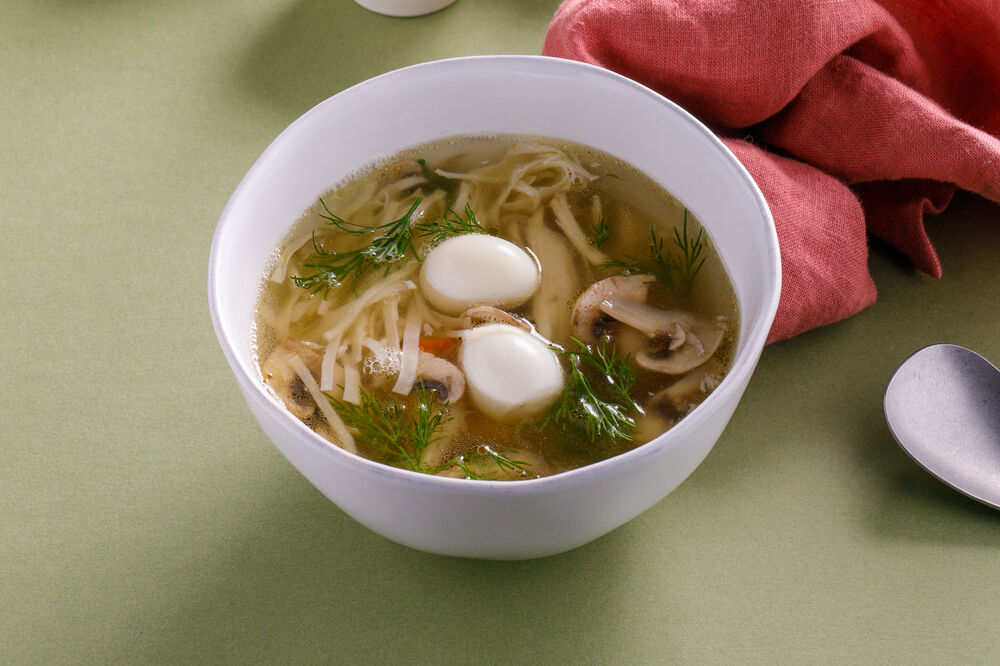 Homemade noodle soup with chicken and mushrooms