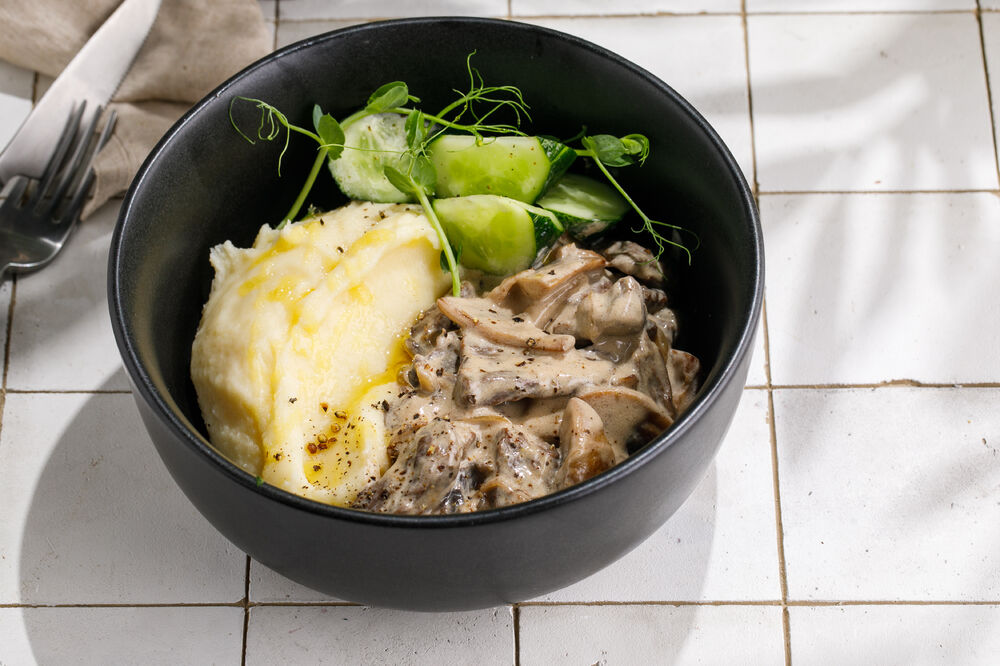 Beef stroganoff with mashed potatoes and lightly salted cucumbers