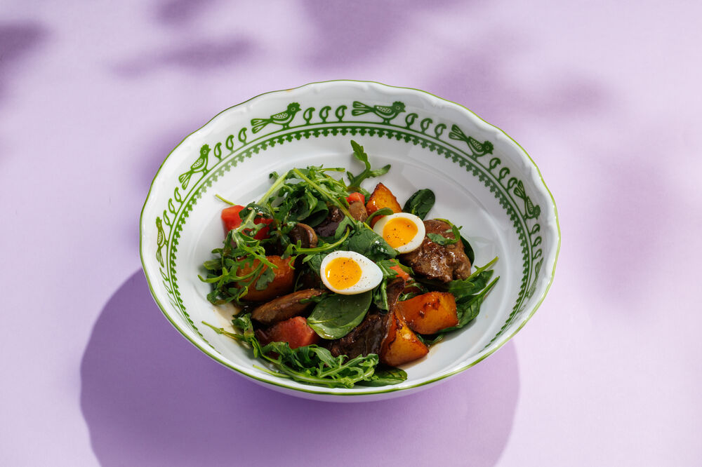 Salad with chicken liver, roasted potatoes, and vegetables