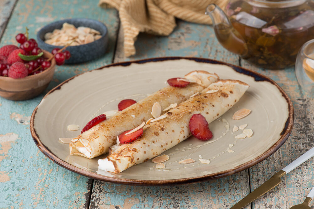 Pancakes with fresh strawberry and tender cream cheese