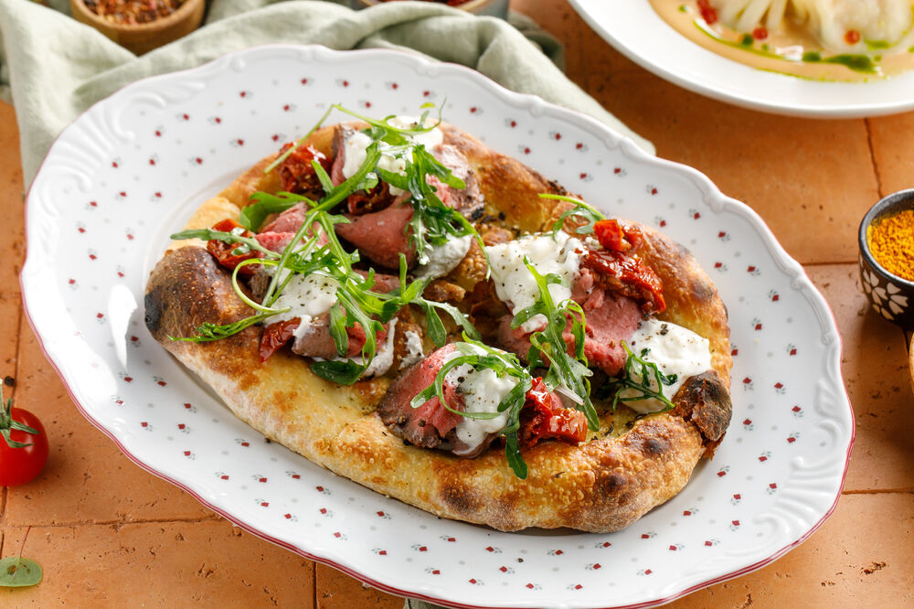 Spiced flatbread with roast beef and stracciatella