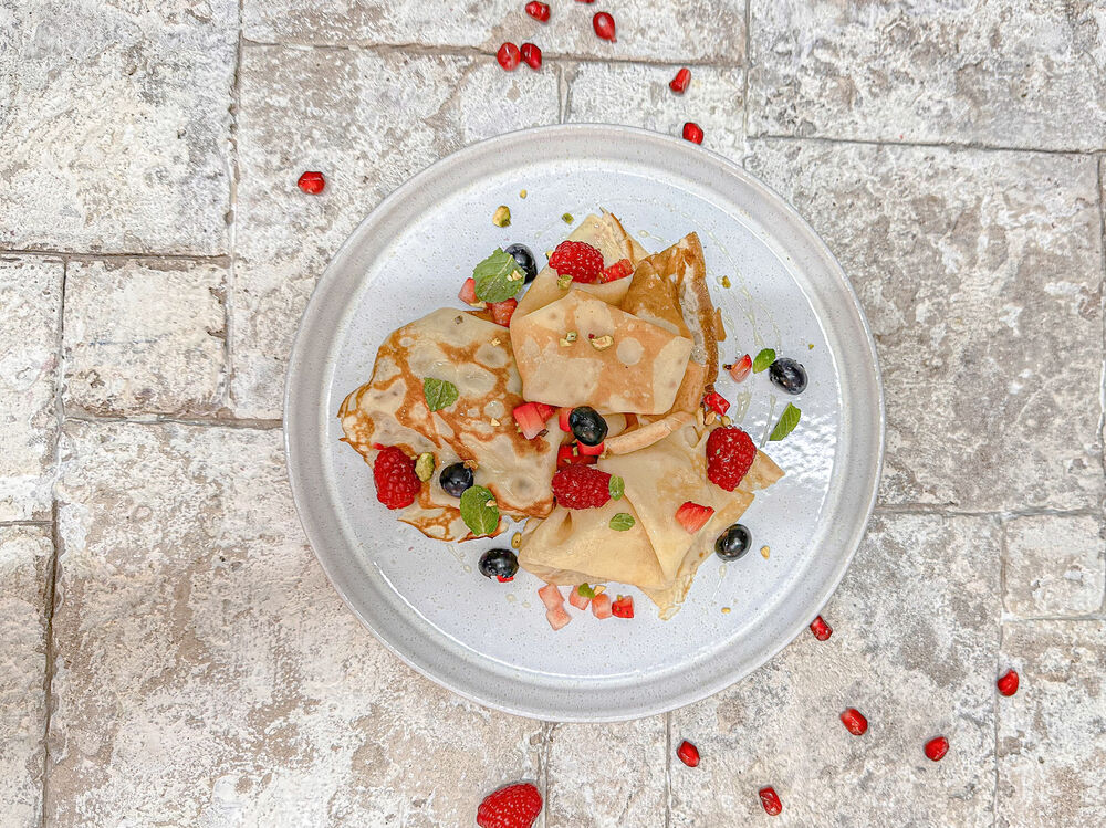 Pancakes with berries and honey