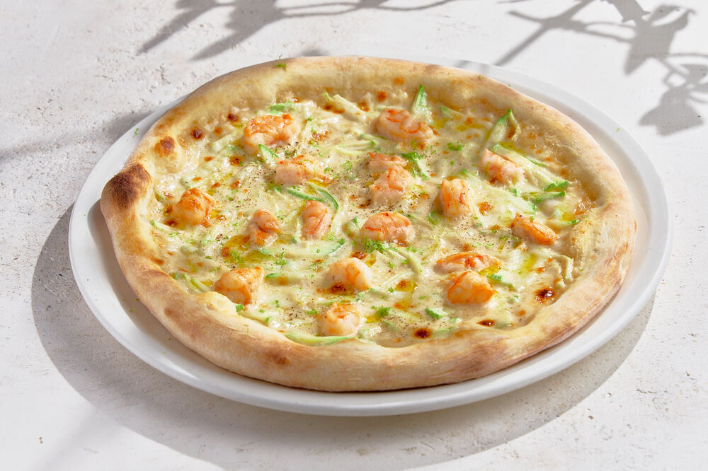 Pizza with shrimps and zucchini