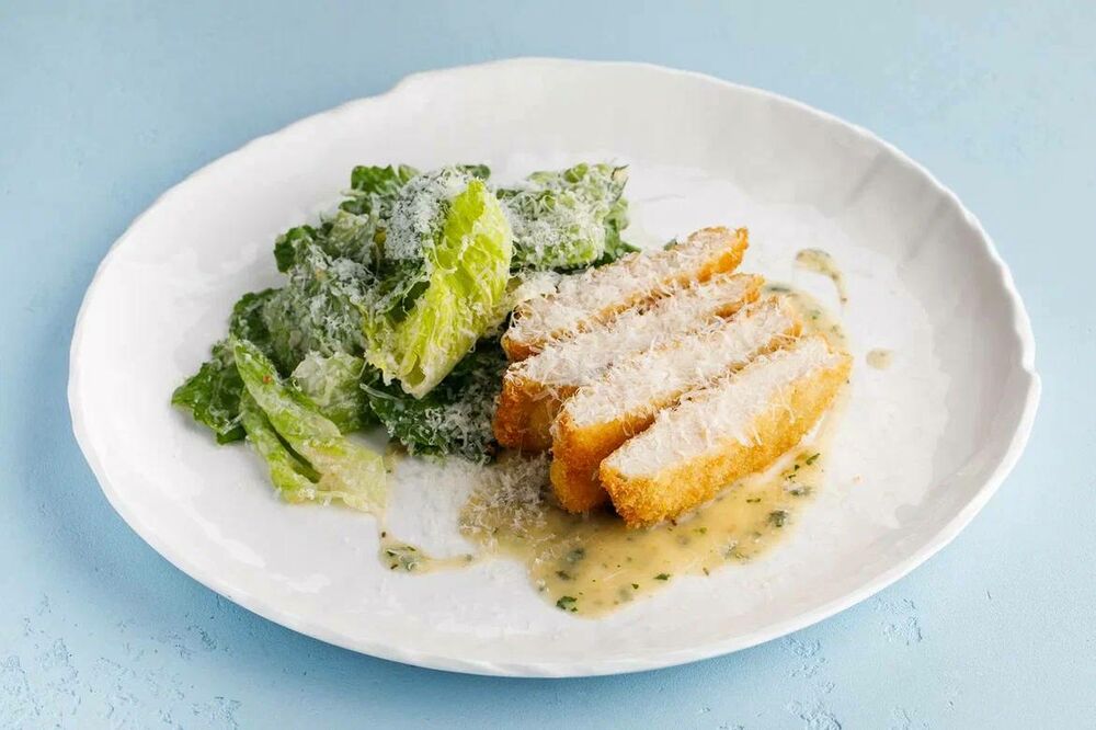 Schnitzel with romaine lettuce and parmesan