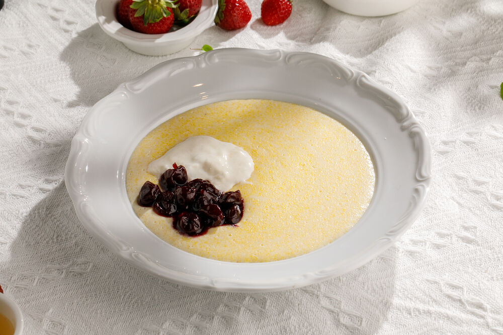 Corn porridge with cherry jam and stracciatella