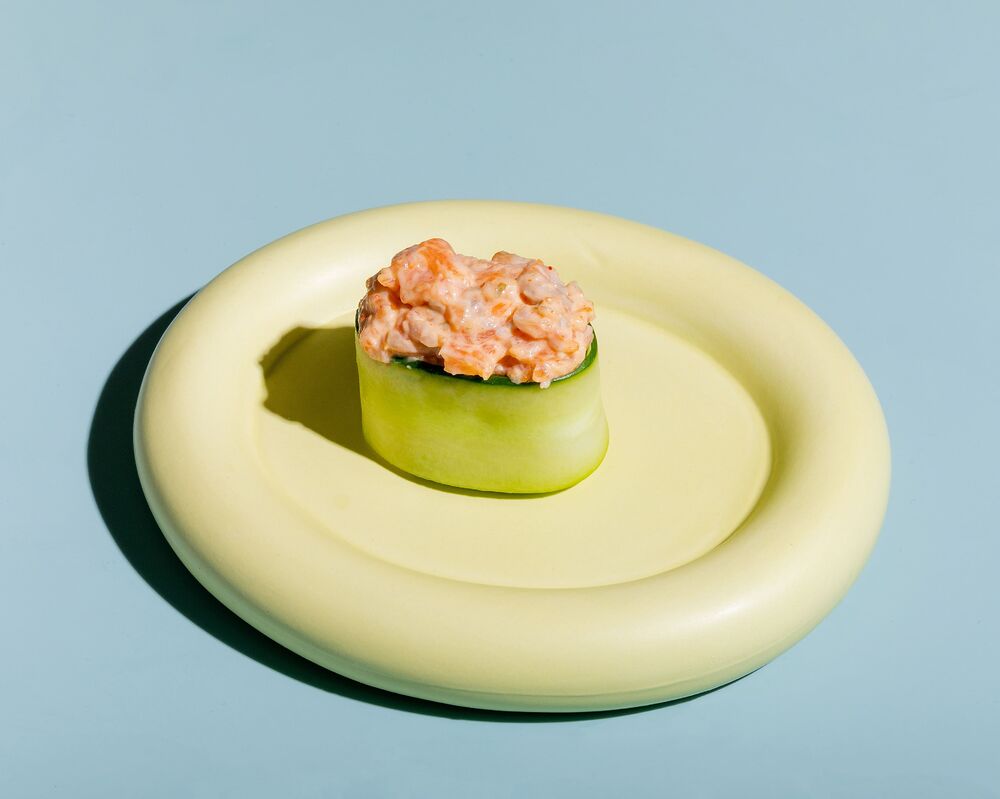 Sushi in cucumber with spicy salmon