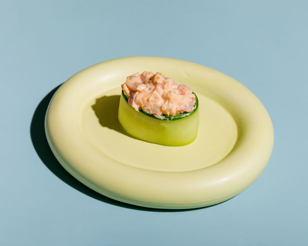 Sushi in cucumber with spicy perch