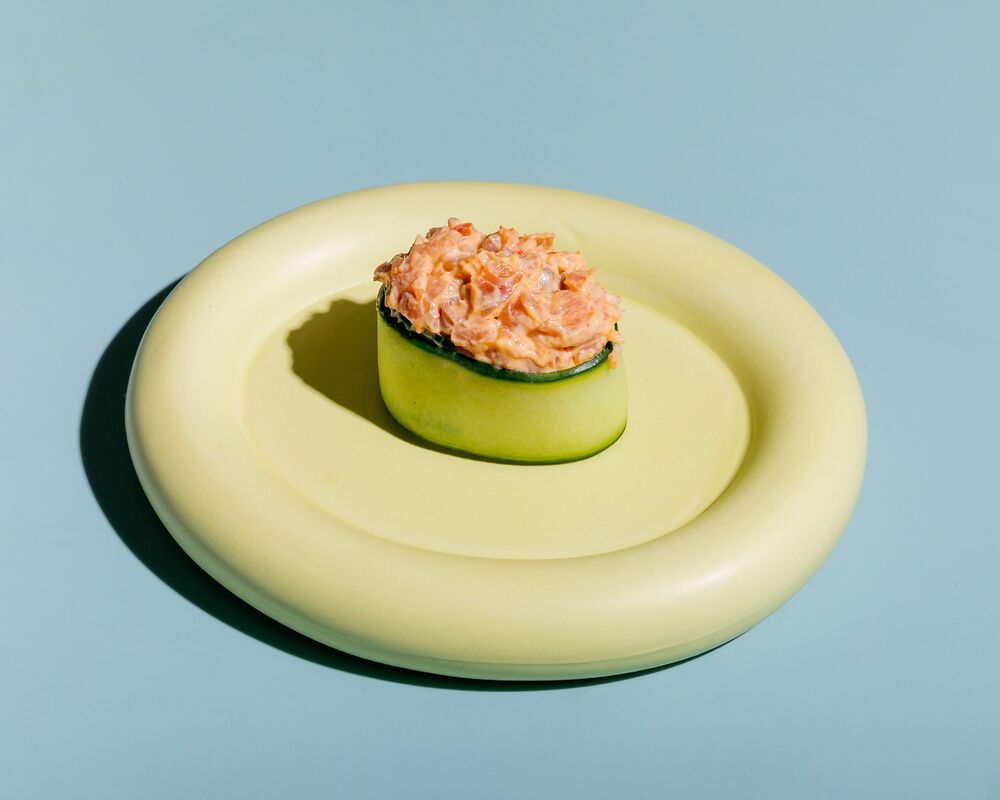 Sushi in cucumber with spicy smoked salmon