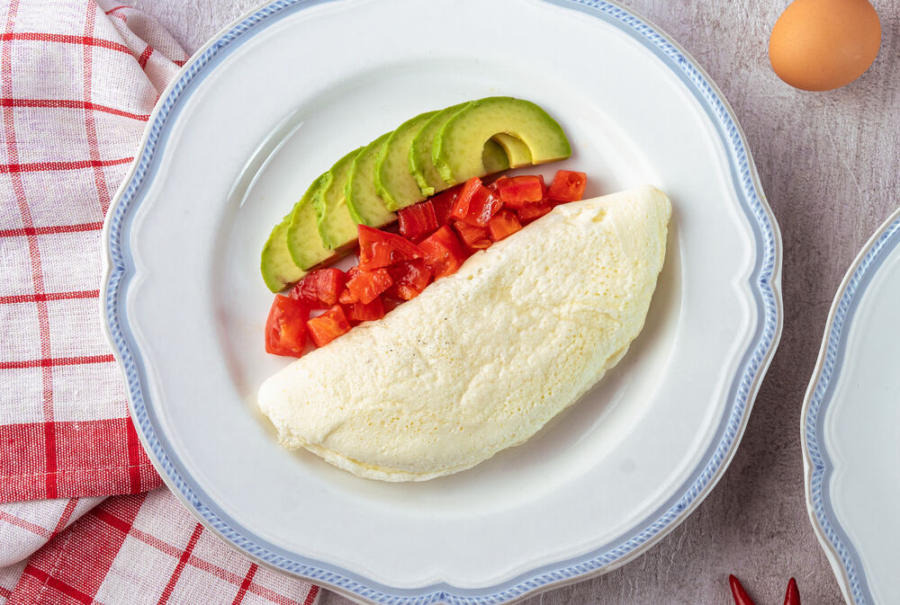 White omelette with avocado and tomatoes