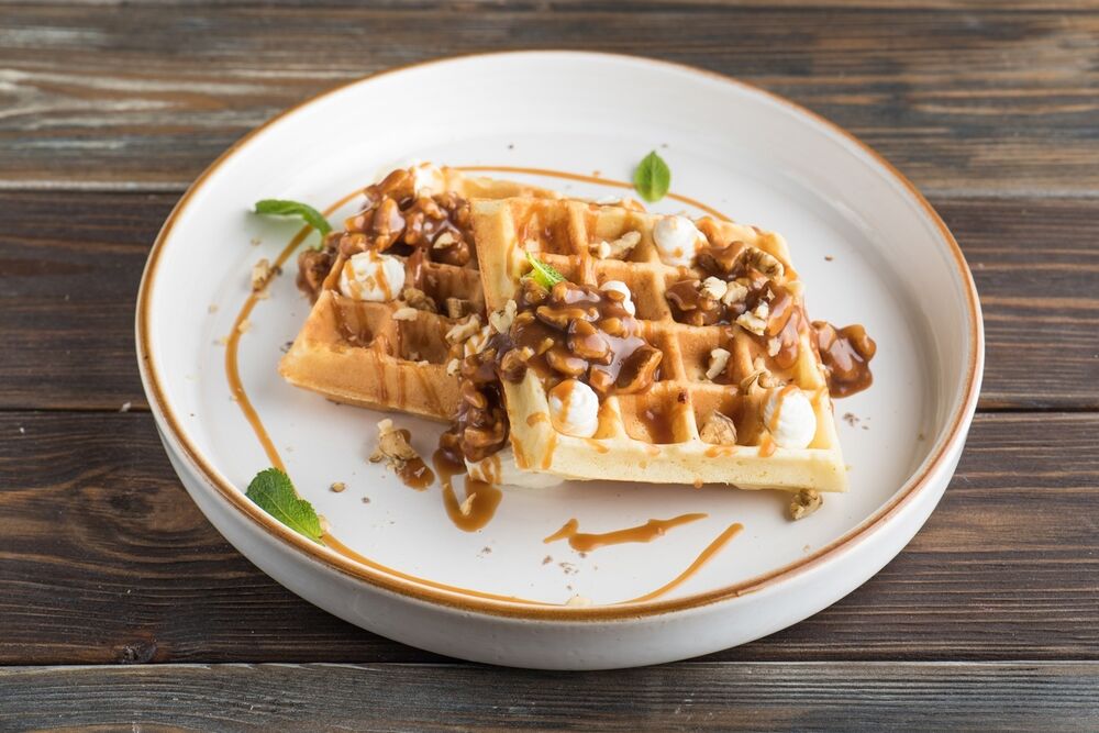 Waffles with salted caramel, nuts and cottage cheese mousse