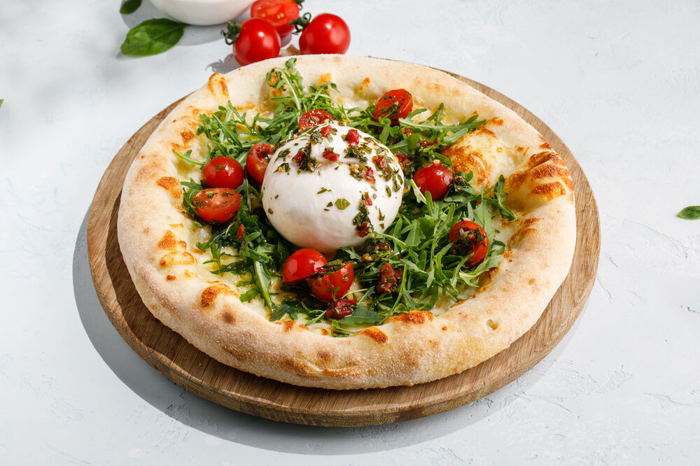  Pizza with burrata, sun-dried tomatoes and Chimichurri sauce