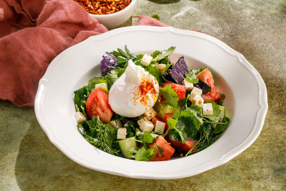 Vegetable salad with poached egg