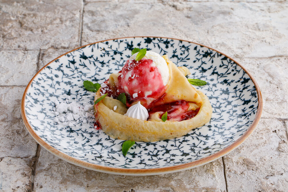 Pancake with raspberry jam and ice cream