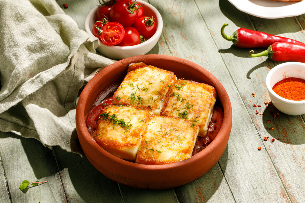 Fried smoked suluguni cheese with fresh tomatoes