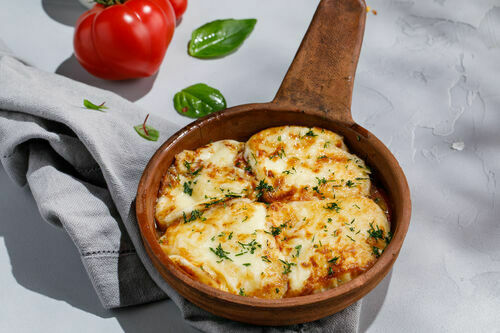 Fried smoked suluguni cheese with fresh tomatoes