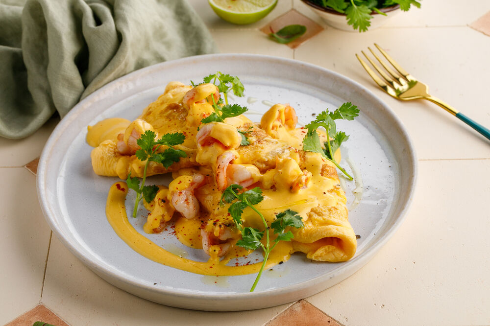 Omelet with shrimp and bisque sauce