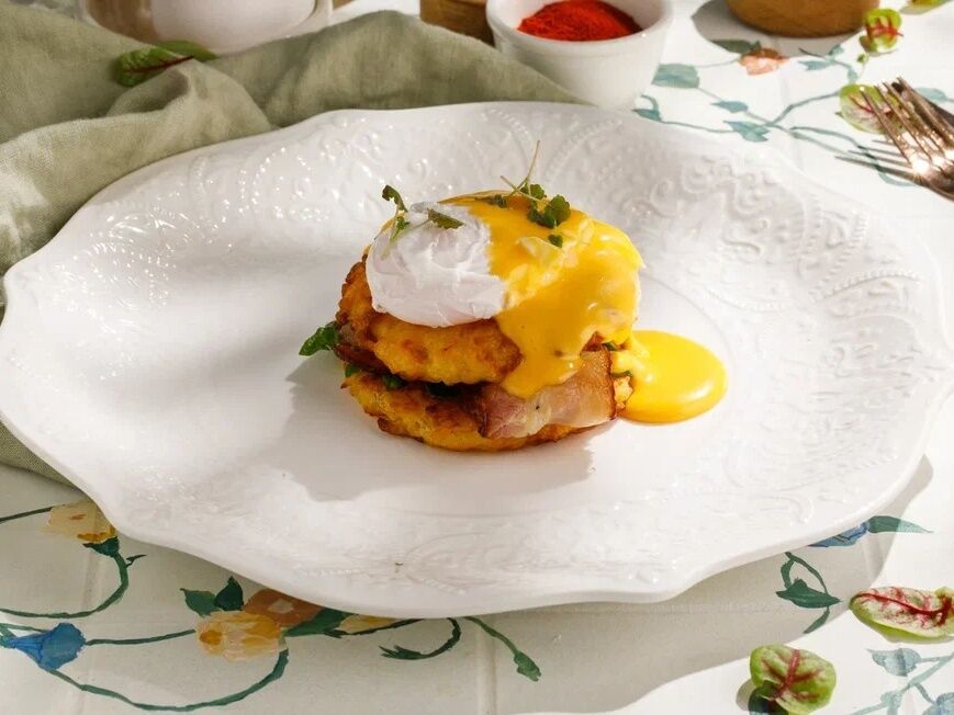 Potato pancakes with bacon and poached egg