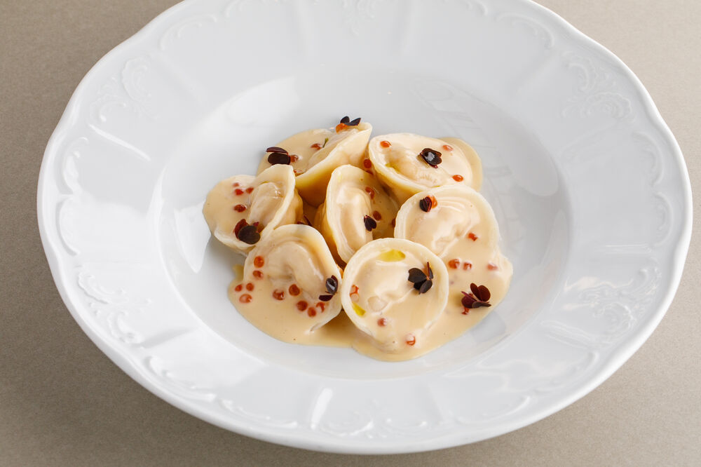 Salmon and cod dumplings with melted milk sauce