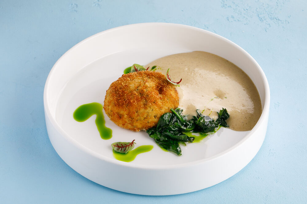Fish cutlet with cod liver, spinach and potato cream