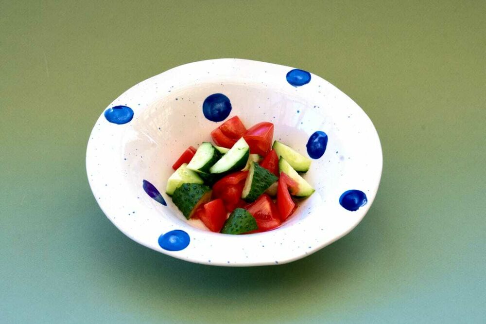 Cucumbers and tomatoes with sour cream