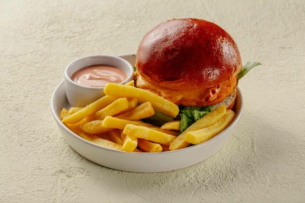Cheeseburger with chicken and French fries