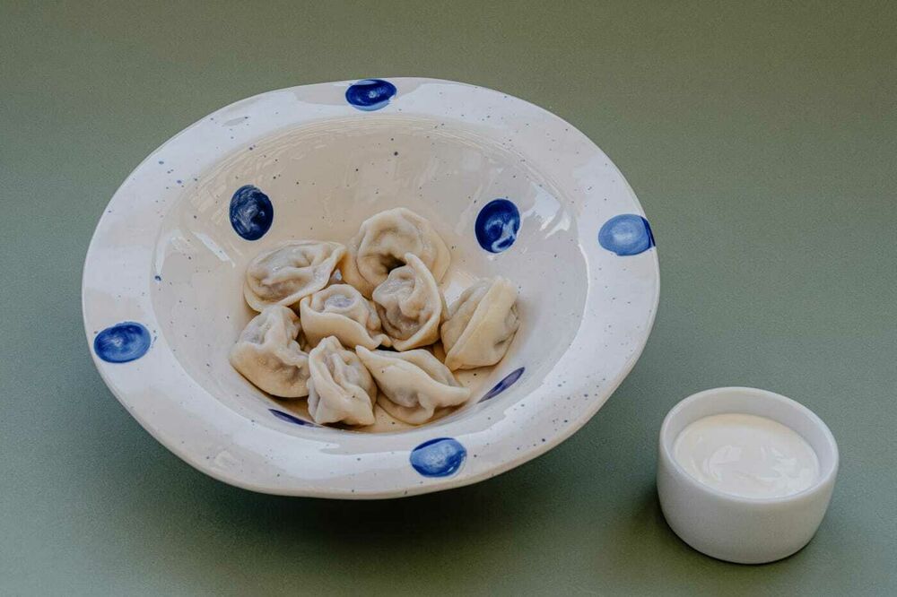 Colored dumplings with sour cream