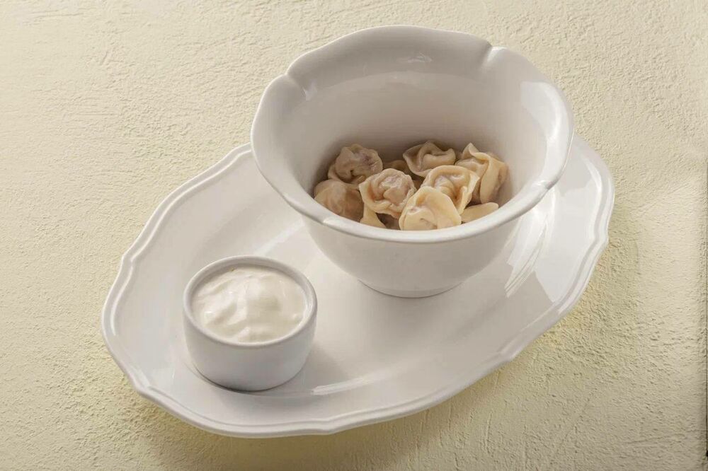Colored dumplings with sour cream