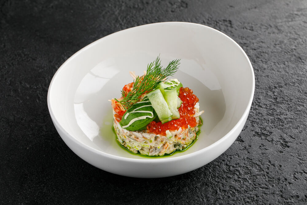 Salad with crayfish necks, avocado and caviar
