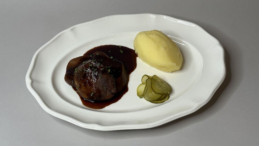 Smoked beef tongue steak with mashed potatoes