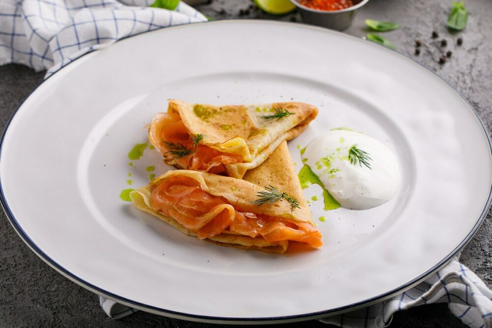 Pancakes with trout, cream cheese cheese with hollandaise sauce