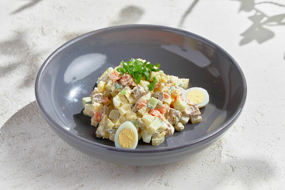 Olivier salad with beef tongue