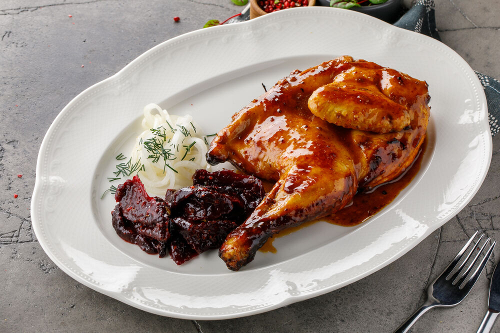 Baked chicken with dried beets in tkemali sauce
