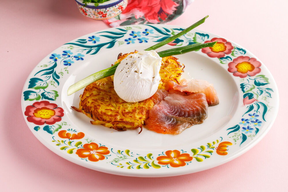 Potato pancakes with muksun and poached egg