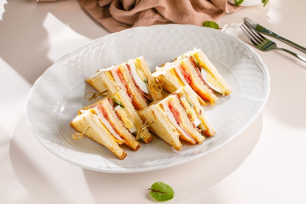 Club sandwich with farm chicken, bacon and egg