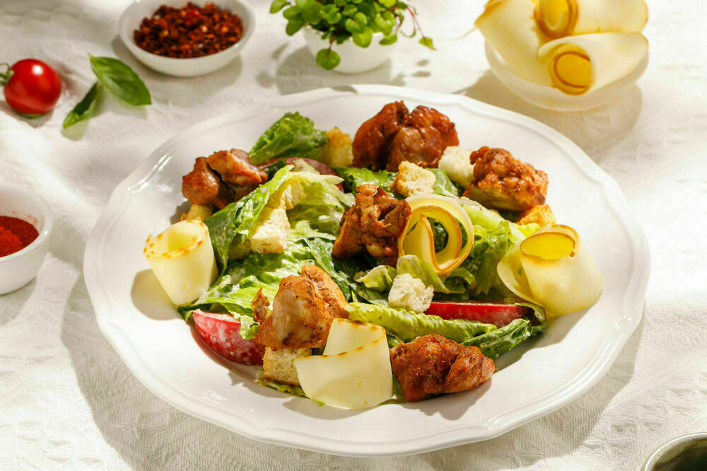 Warm salad with chicken and smoked suluguni cheese