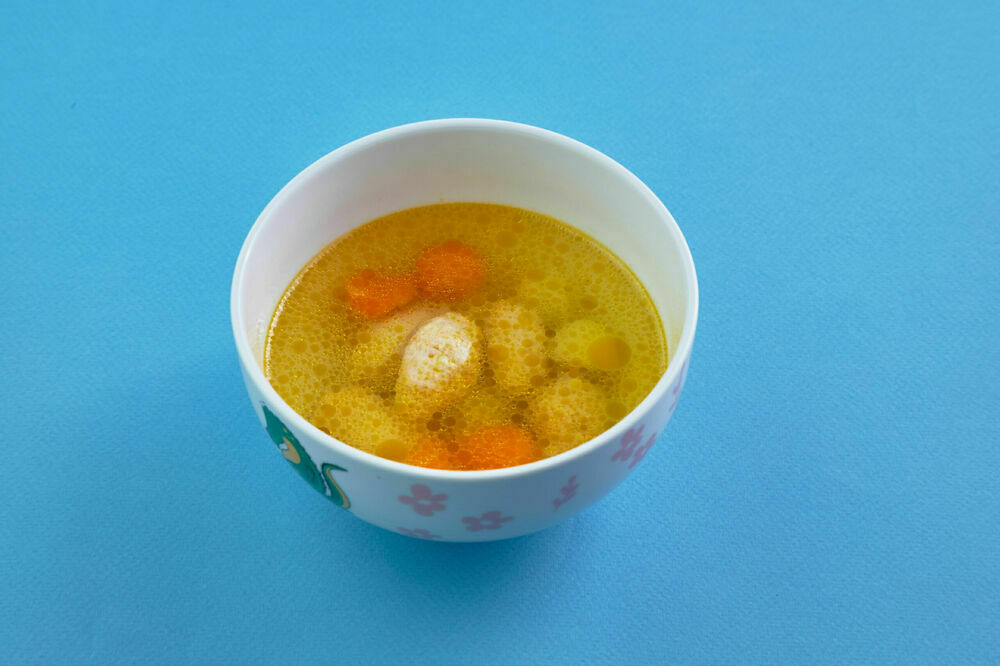 Soup with quenelles of Turkey for children