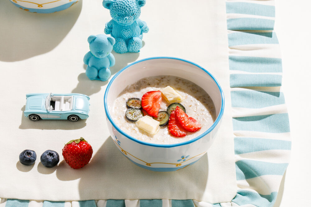 Oatmeal porridge with berries on water
